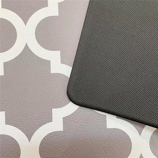 Waterproof kitchen floor mat demonstration in a modern home